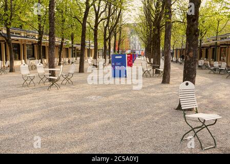 Romantic Kurhaus Colonnade in spa town Baden-Baden, Germany. Nostalgic charm with boutiques and horse chestnut trees. Stock Photo