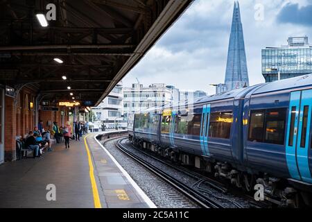 Train arriving at the Waterloo station in London with a view of the Shard skyscraper on the background Stock Photo