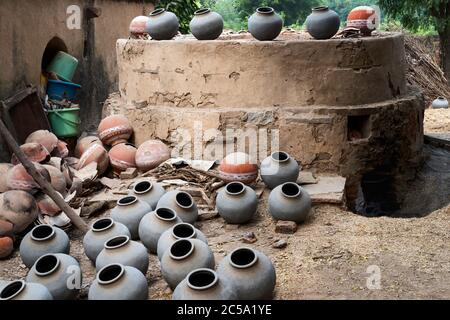 Traditional potters brick kiln with fired pots on the floor in a small village in Bundi, Rajasthan, India. Stock Photo