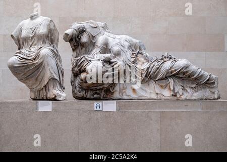 Statues of greek goddesses, part of the Elgin Marbles exhibited at the British Museum and originally located at the Parthenon in Athens Stock Photo