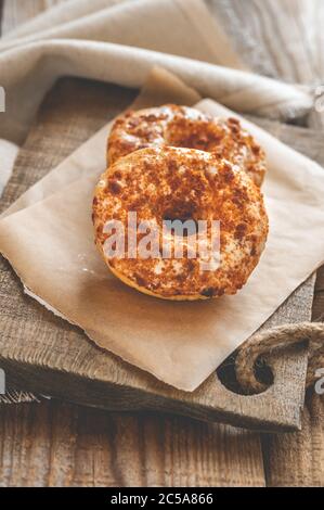 Two donuts on the wooden board Stock Photo