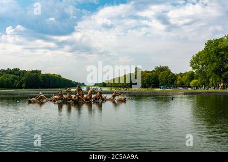 Versailles, France - August 27, 2019 : Apollo Fountain, constructed between 1668 and 1671, depicts the sun god driving his chariot to light the sky. Stock Photo