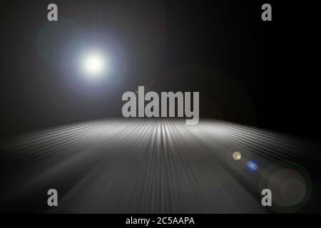 Streaks of light on night road. Abstract background of light lines. Perspective of luminous stripes. Stock Photo