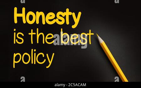 Honesty is the best policy - written on black paper with yellow pencil. Business transparency concept