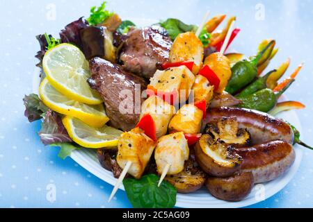Dish of tasty bulgarian meshana scara with different cooking meat and vegetables Stock Photo