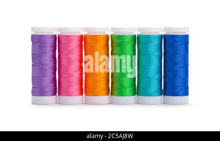 Sewing Thread Spools in Rainbow Arangement Isolated on White. Stock Photo
