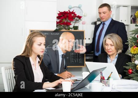Confident businessman discussing new business project with members of his team Stock Photo