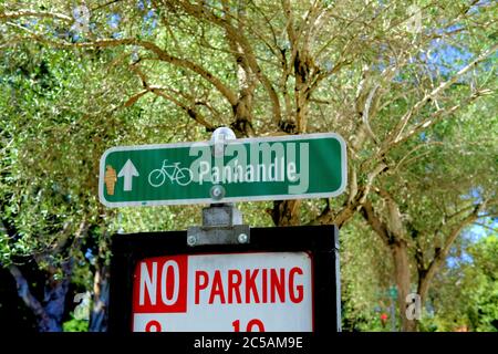 Sign for bicycle riders pointing to Panhandle Park in San Francisco, California, USA; No Parking bike path traffic flow. Stock Photo