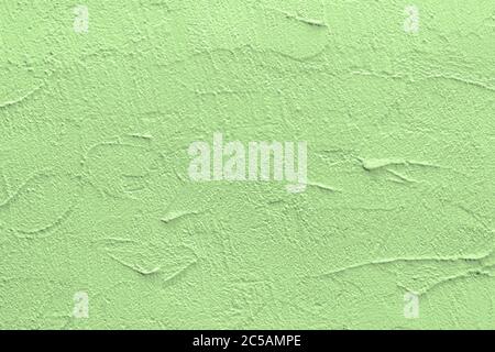 Green stucco texture. Architectural abstract background. Pistachio wall of building. Stock Photo