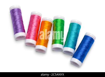 Sewing Thread Spools in Rainbow Layout Isolated on White. Stock Photo