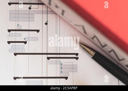 Construction project planning, management concept, gantt chart schedule, blueprints, helmet, calculator different management tools Stock Photo