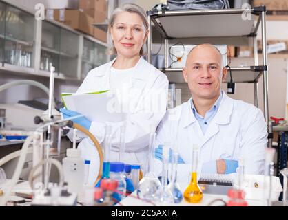 Portrait of two professional genetic scientists in modern researching laboratory Stock Photo