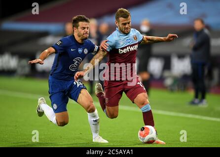 Chelsea's Cesar Azpilicueta (left) and West Ham United's Jack Wilshere battle for the ball during the Premier League match at the London Stadium. Stock Photo