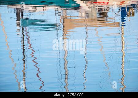 Reflections of boat masts in Scarborough Harbour Stock Photo