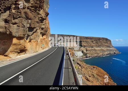 Road along the south coast of Gran Canaria. View on Taurito resorts. It is popular resort of island with public beach, shopping facilities and restaur Stock Photo