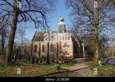 Old Castle chapel and cemetery next to castle ruins in the Dutch village of Egmond aan den Hoef. Build, rebuild in 1229, 1431. Netherlands, February Stock Photo