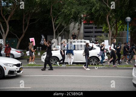 West Hollywood, CA/USA - May 29, 2020: Black Lives Matter protesters blocking traffic on Santa Monica Boulevard Stock Photo