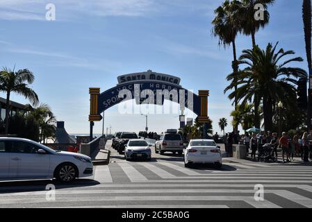 Santa Monica, CA/USA - April 11, 2019: Crowds of people flocking to the Santa Monica Pier on a beautiful day Stock Photo