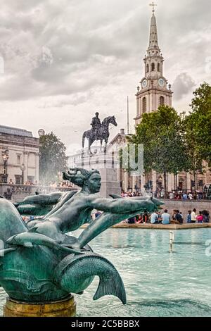 Fountain at Trafalgar Square and Saint Martin on the Fields church in London Stock Photo