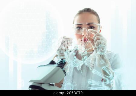 Medical Scientist Researcher Using Microscope in Laboratory,  Medicine Specialist Studying and Experiment Anti Virus Pharmaceutical With Microscopic. Stock Photo