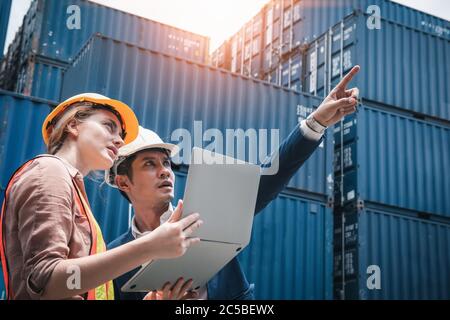 Business Team Container Cargo Shipping Control Inspection Loading Dock and Management Import/Export Freight at Port Ship Yard. Manager and Foreman Tea Stock Photo