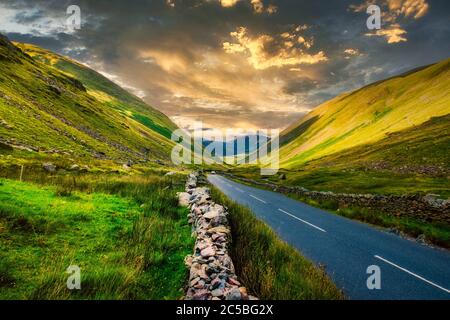Sunset on a valley among the mountains at the beautiful Lake District in England Stock Photo