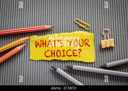 What's Your Choice. Text on torn, yellow paper on corrugated background Stock Photo