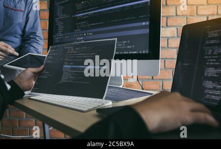 Asian man working code program developer computer web development working design software on desk in office. Stock Photo