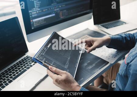 Asian man working code program developer computer web development working design software on desk in office. Stock Photo