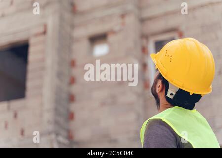 Young man architect on a building construction site Stock Photo