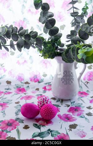 Happy Easter Day Around Pink Flowers With Pink Eggs On a Pink Background Stock Photo