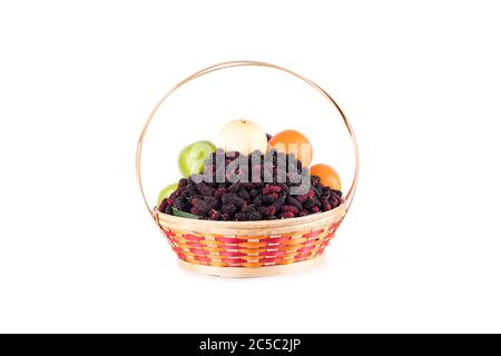 fresh orange, Chinese pear, green apple and mulberry in bamboo wicker basket on white background fruit health food isolated Stock Photo