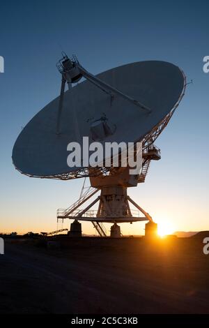 Sunburst through the base of a radio astronomy telescope at the VLA (very large array) in New Mexico Stock Photo
