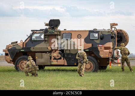 Australian Army soldier with a Bushmaster armored personnel carrier ...