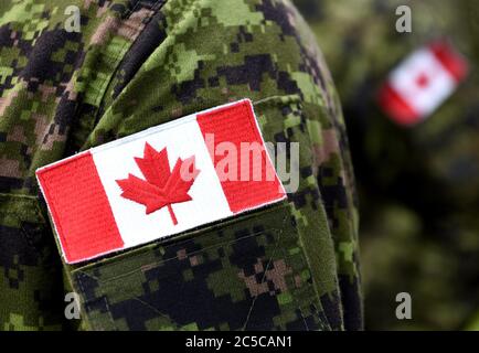 Flag of Canada on the military uniform. Canadian soldiers. Army of Canada. Remembrance Day. Poppy day. Canada Day. Stock Photo
