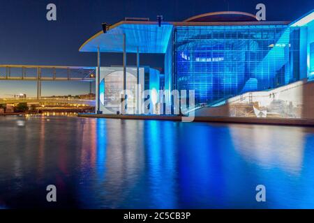 View over river Spree in Berlin to illuminated Paul-Loebe building in the government quarter in evening twillight Stock Photo