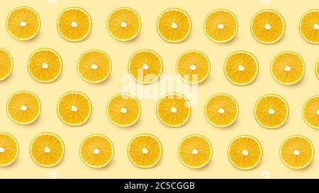 Seamless pattern with orange slices on yellow background. Top view citrus flat lay Stock Photo