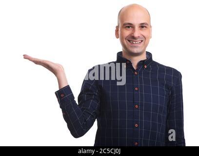 Handsome bald man smiling and presenting some product on his palm. Isolated on white Stock Photo