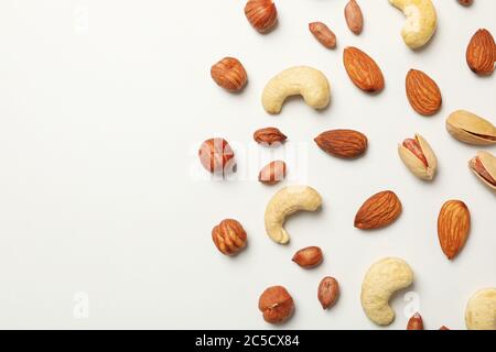 Different tasty nuts on white background. Vitamin food Stock Photo