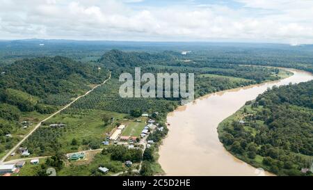 small town near the river kinabatangan in borneo, Malaysia surrounded by palm tree oil Stock Photo
