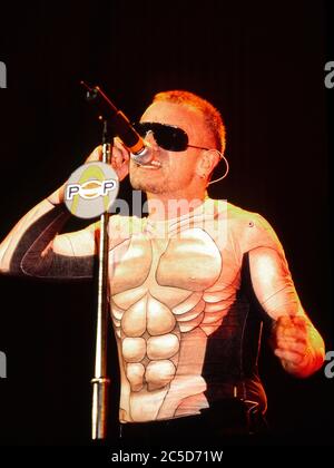 U2 on the opening night of their Pop Mart Tour 25th April 1997 at the Sam Boyd Stadium, Las Vegas,USA:  Bono Stock Photo