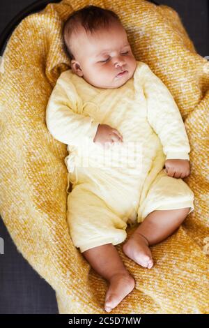 High angle view of baby girl sleeping in the bed Stock Photo