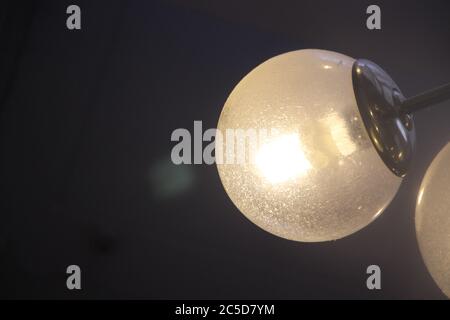 Light bulb on dark background, concept of creativity Stock Photo