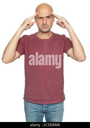 Serious bald man trying to remember something. Isolated on white studio background Stock Photo