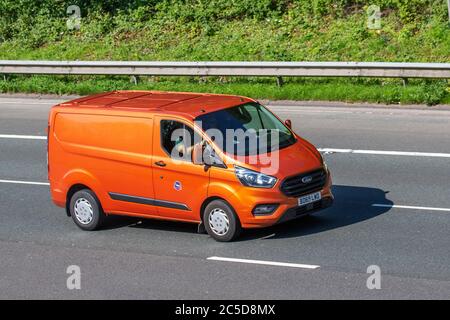 2019 orange Ford Transit Custom 300 Trend; Vehicular traffic moving vehicles, cars driving vehicle on UK roads, motors, motoring on the M6 motorway highway network. Stock Photo