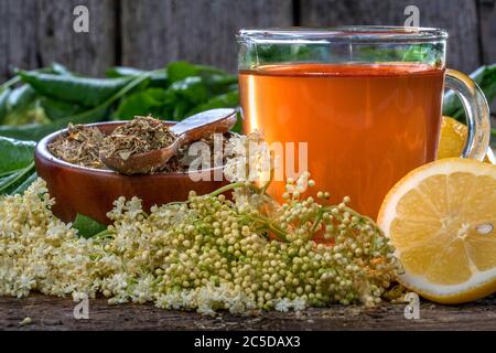 Domestic elderflower healthy and refreshing summer drink on a rustic wooden table. The concept of healthy eating and lifestyle. Stock Photo