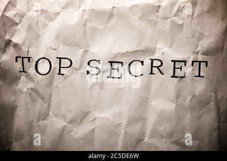 Top secret sentence on a brown paper. Stock Photo