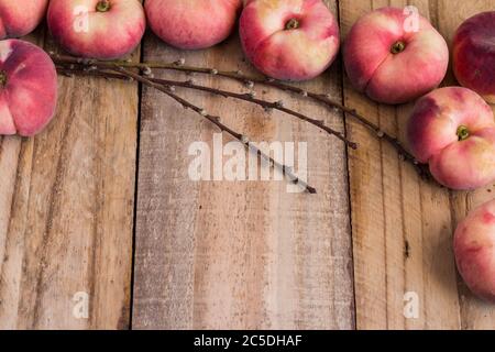 Rustic flat donut peach background on rough wooden plank background - space for text Stock Photo