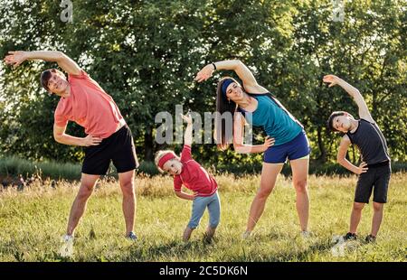 Family with two kids doing pilates with softball - Stock Photo [103174470]  - PIXTA