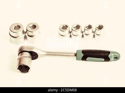 Ratchet wrench. Steel made no skid threaded handle hold firmly without slipping. Ratchet tool. Universal socket sets. Can be used in hard to reach places. Knob for socket wrench nut ratchet close up. Stock Photo